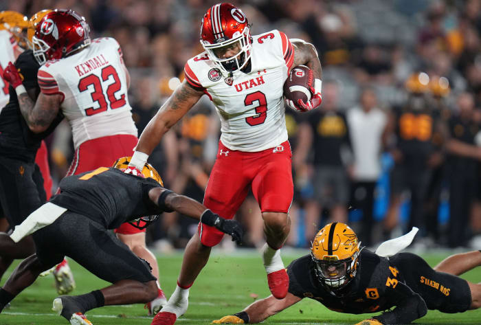 Utah's Ja'Quinden Jackson (3) runs the ball as ASU defenders Jordan Clark (1) and Kyle Soelle (34) dive for the tackle at Sun Devil Stadium on Saturday, Sept. 24, 2022.